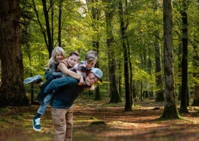 Dad tickling kids during candid photo session in Tarpon Springs Florida